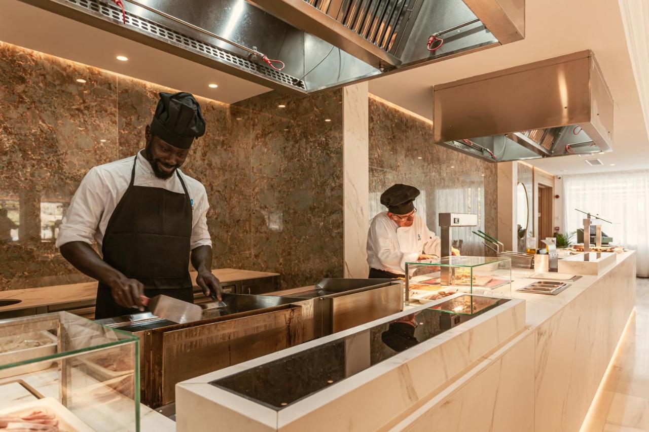 Grupotel Molins Cala San Vicente  Exterior photo The kitchen at the Emirates Lounge at Cape Town International Airport